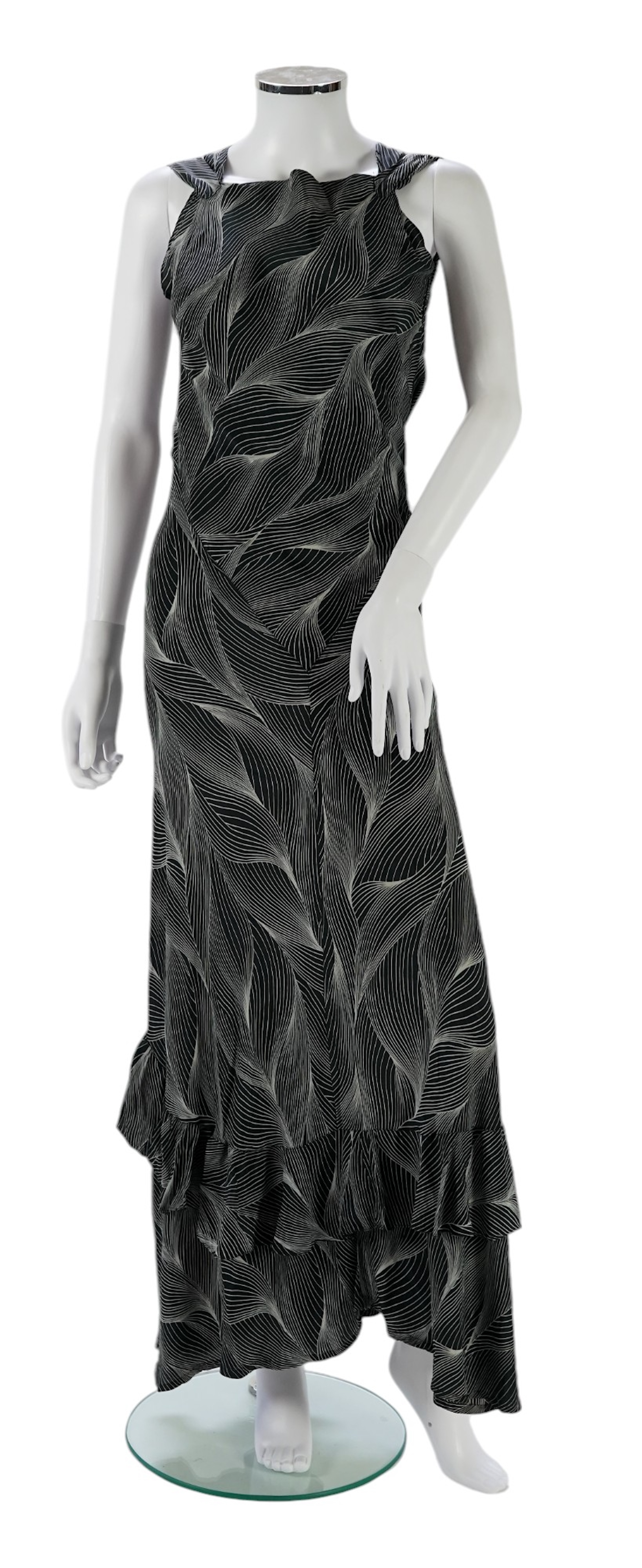 A 1930's black and silver halter neck, bias cut, ladies silk evening dress, designed with a loosely falling back and frills falling from the back of the dress to the front, bust bias cut 32-36 inches, length 57 inches fr